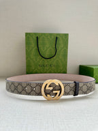 Gucci belt with beige GG canvas, dark leather trim, gold double-G buckle