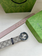Gucci belt with pale pink leather strap and beige GG panel, dark buckle detail