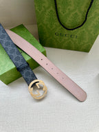 Gucci belt with pink leather side and gold-toned circular buckle