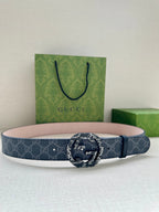 Gucci belt with dark blue GG canvas and circular logo buckle