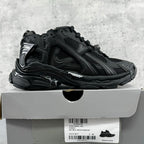 Balenciaga unisex black sneakers with chunky soles, side profile, lace-up design