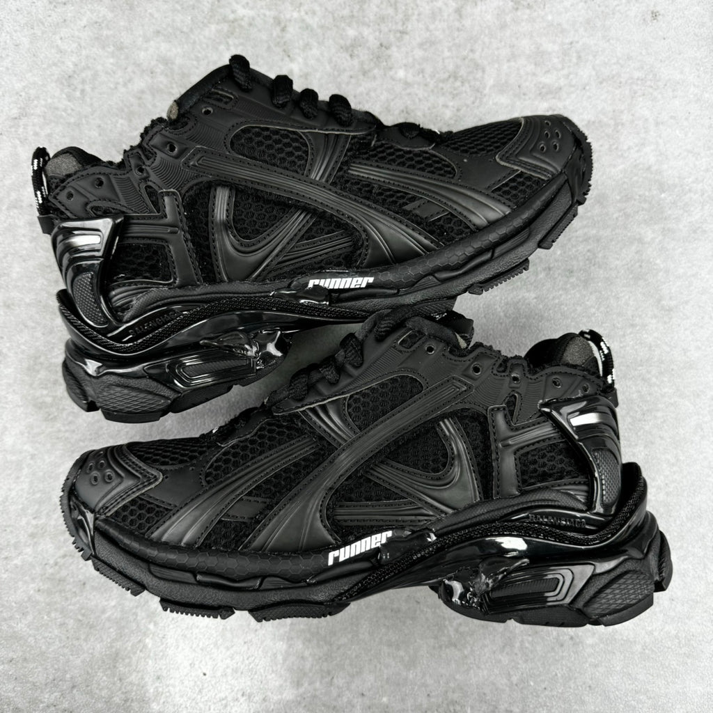 Balenciaga unisex black running-style sneakers, mesh and stitched panels, lace-up pair