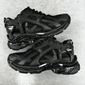 Balenciaga unisex black running-style sneakers, mesh and stitched panels, lace-up pair