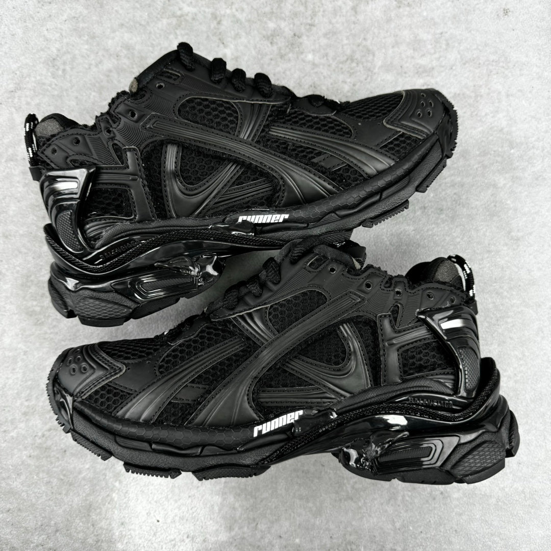 Balenciaga unisex black running-style sneakers, mesh and stitched panels, lace-up pair