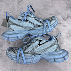 Unisex sneakers pair, light blue uppers, patterned side panels, lace-up with chunky sole