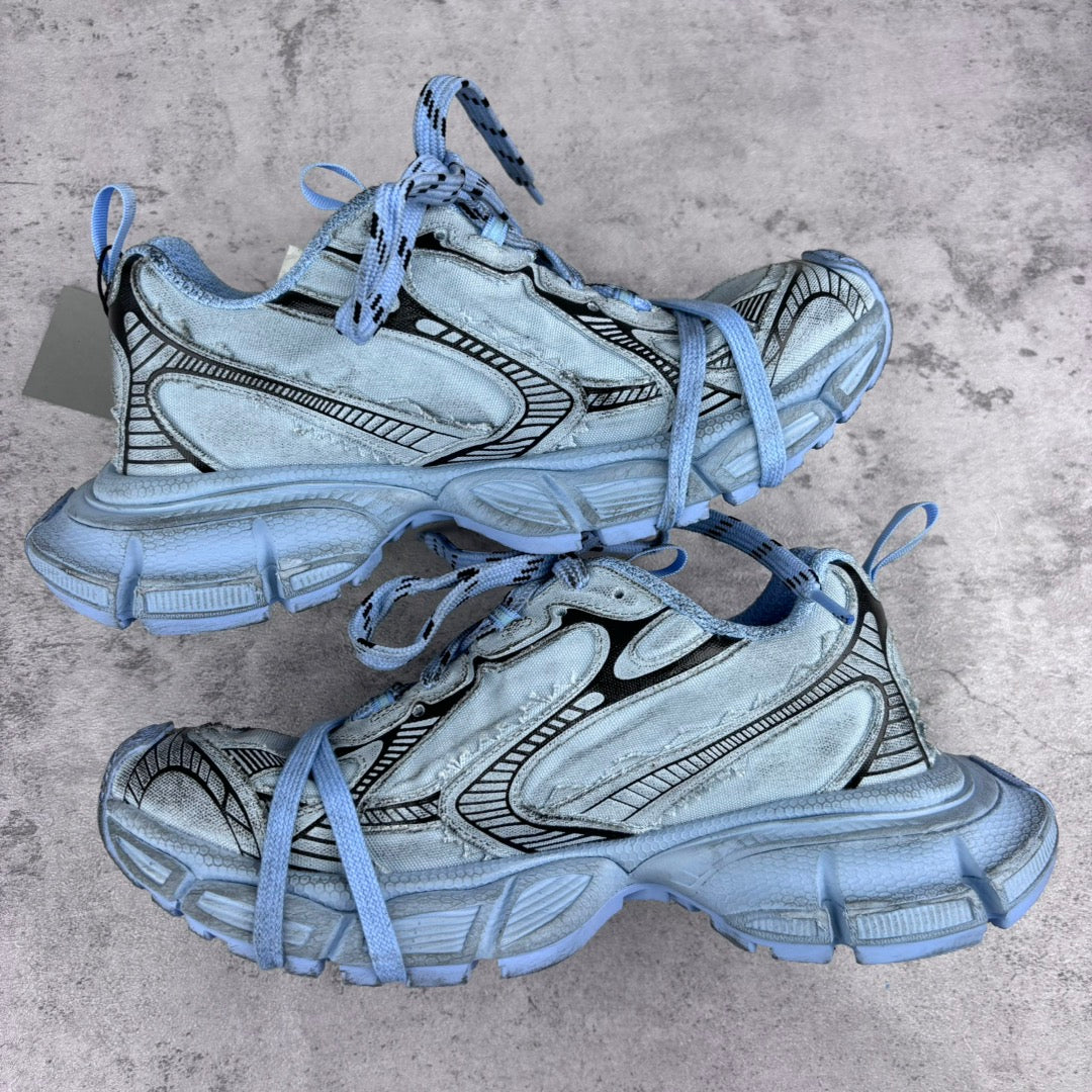 Unisex sneakers pair, light blue uppers, patterned side panels, lace-up with chunky sole