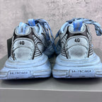 Unisex sneakers heel view, light blue uppers with size 40 label, lace-up chunky sole