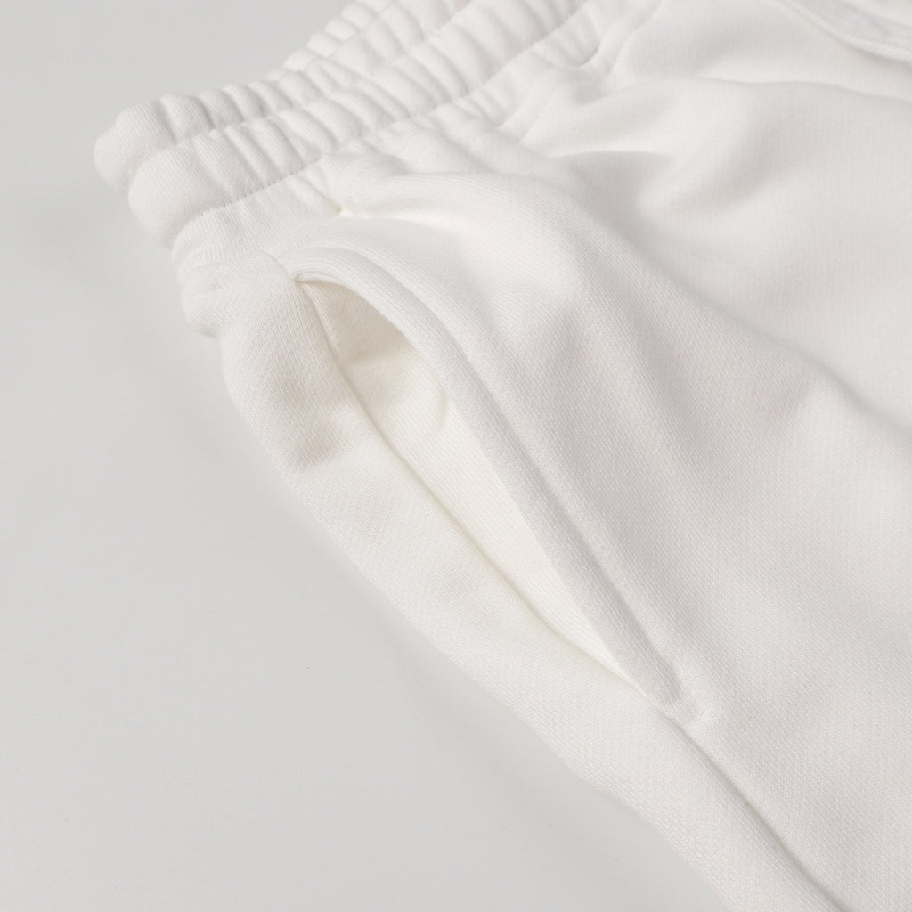 White shorts with elastic waistband and smooth fabric fold detail
