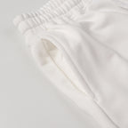 White shorts with elastic waistband and smooth fabric fold detail