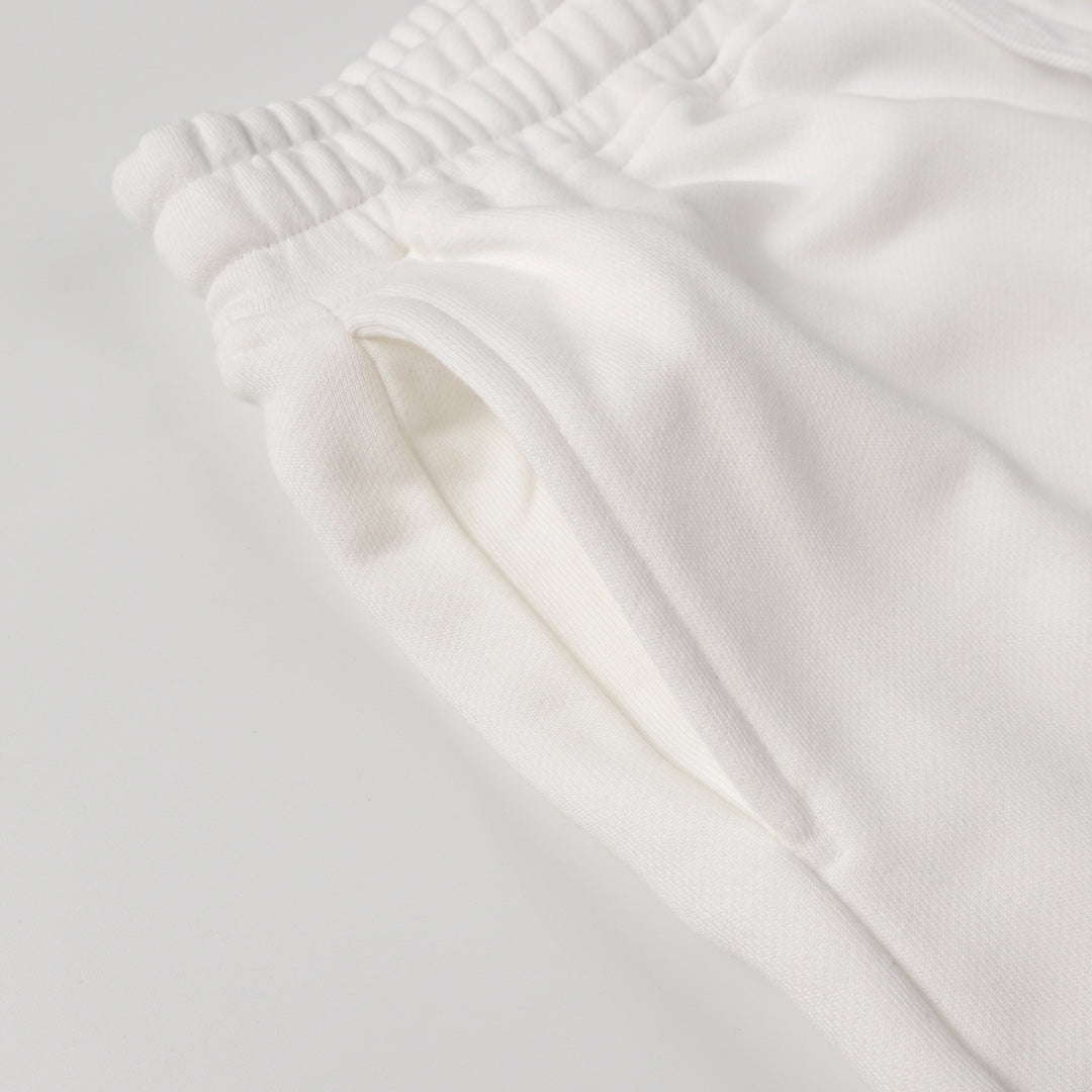 White shorts with elastic waistband and smooth fabric fold detail