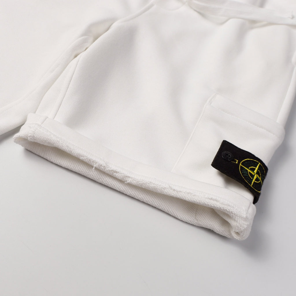 White shorts hem with side pocket and black Stone Island patch logo