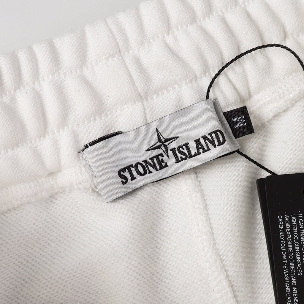 White shorts waistband with Stone Island brand label tag