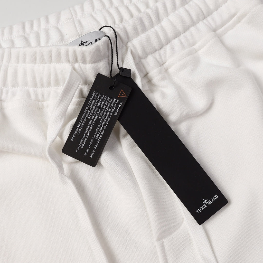 Stone Island white drawstring shorts with elastic waistband, hanging label