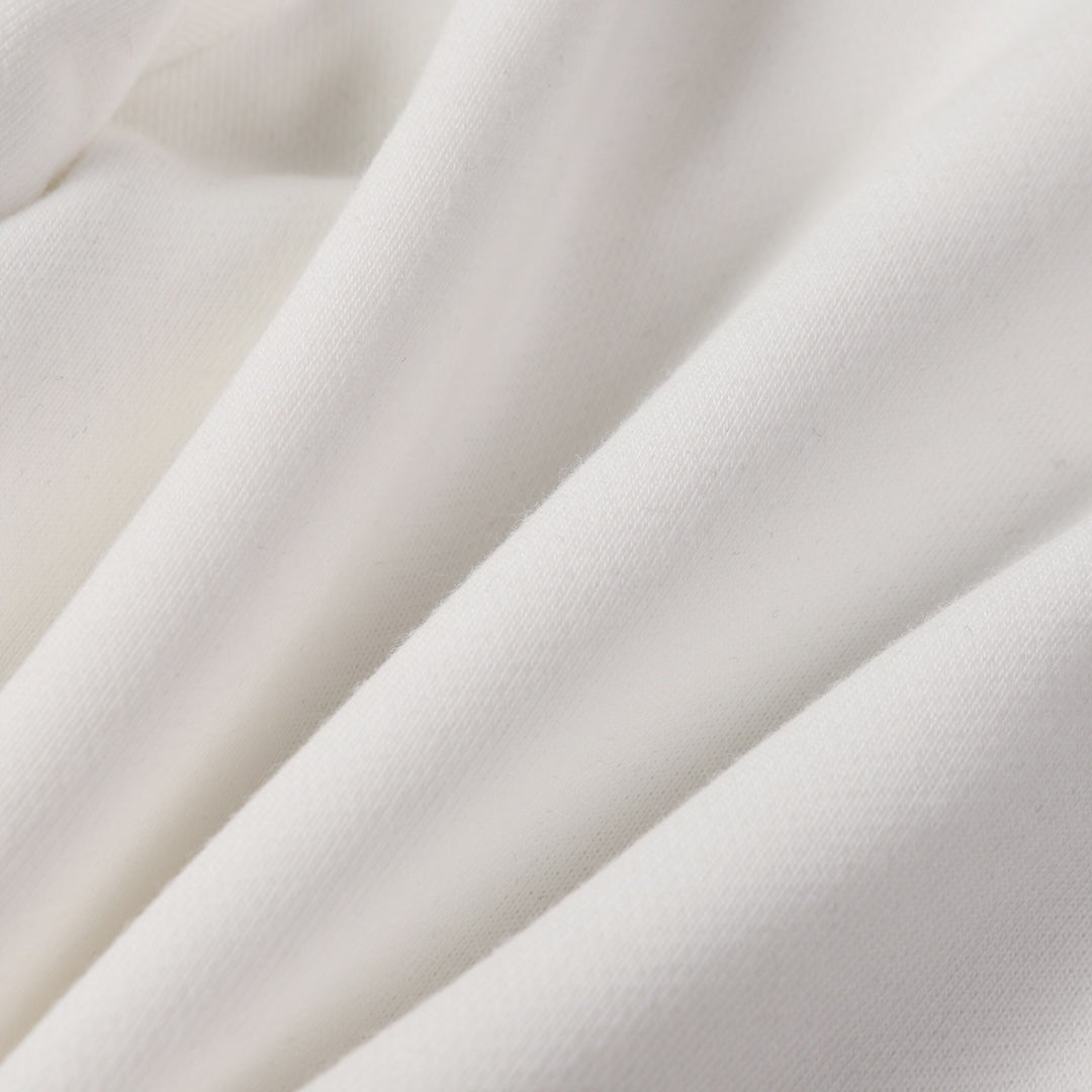 White shorts fabric with soft drape and stitched seams