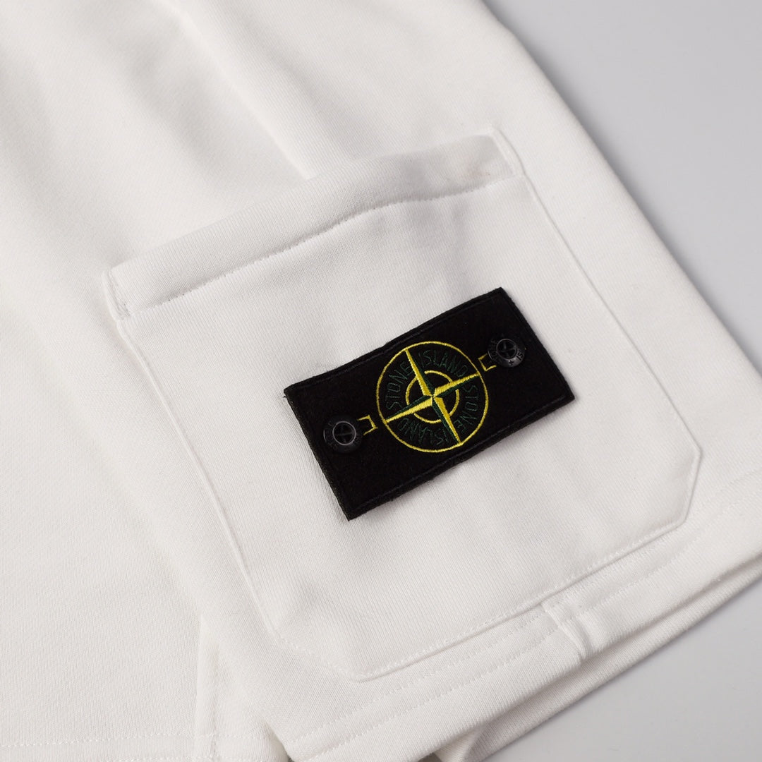 White shorts pocket with black Stone Island patch logo