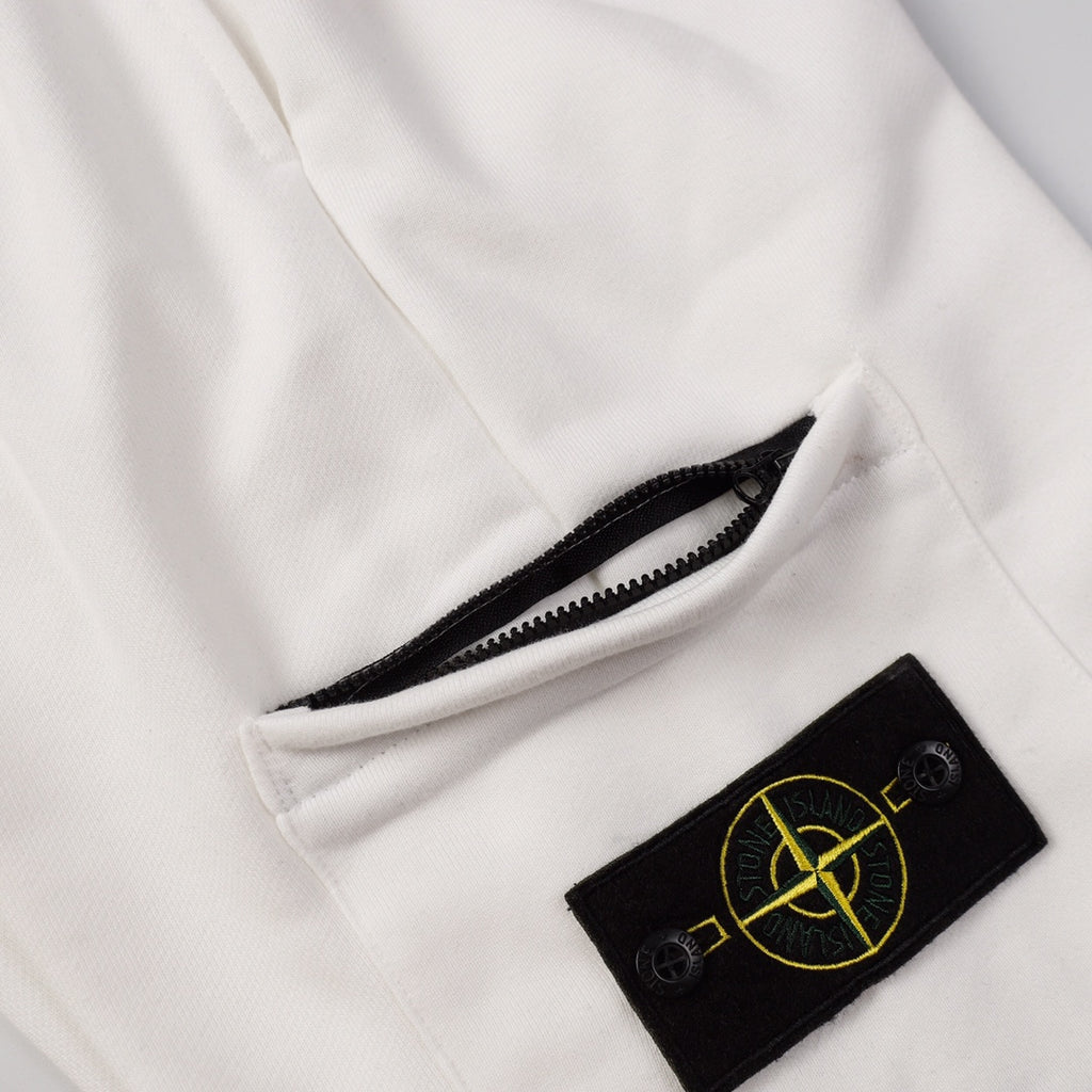 White shorts with zip pocket opening and black Stone Island patch logo