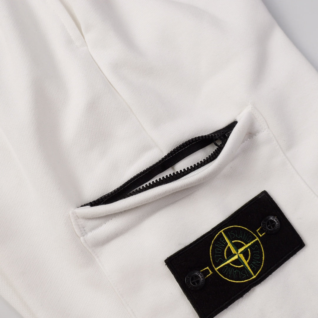 White shorts with zip pocket opening and black Stone Island patch logo