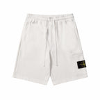 White drawstring shorts with elastic waistband and side pocket detail