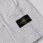 Stone Island shorts fabric with black brand patch and yellow emblem