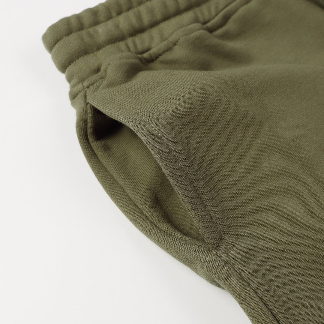 Stone Island jogger pants, olive green knit cuffs and side seam detail