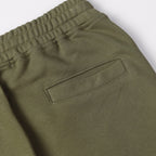 Olive shorts with elastic waistband and rectangular side pocket