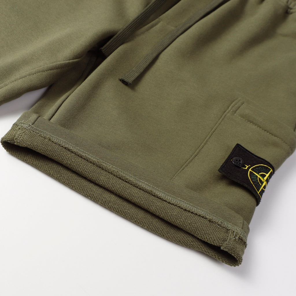 Stone Island jogger pants, olive green with front pocket and logo patch