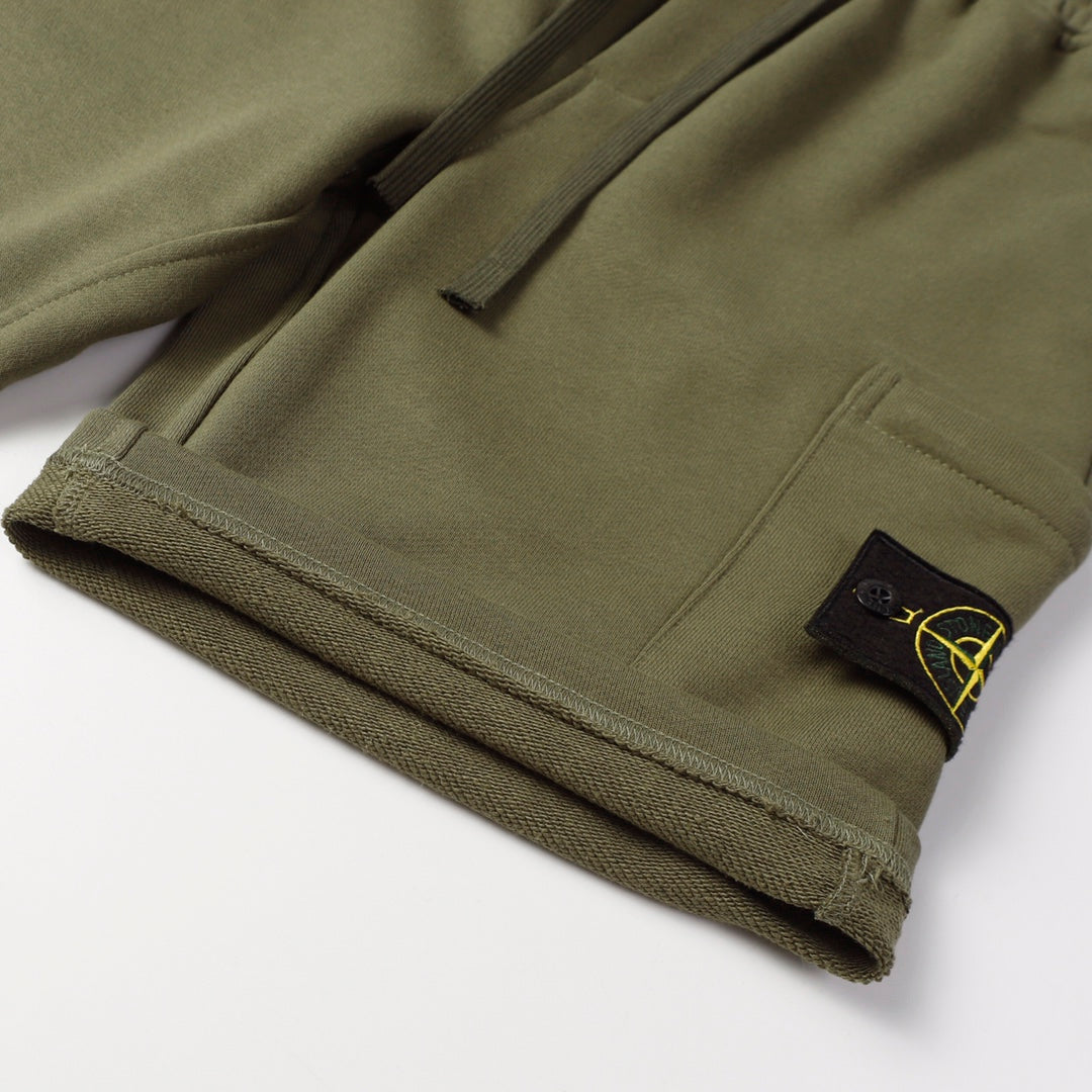 Stone Island jogger pants, olive green with front pocket and logo patch