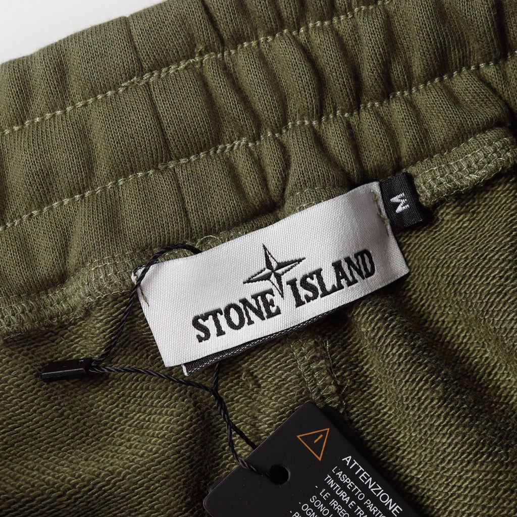 Olive shorts waistband with Stone Island label and black drawstring cord