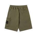 Olive drawstring shorts front view with elastic waist and right cargo pocket