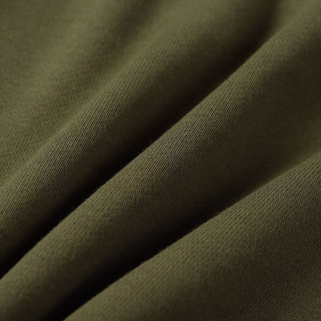 Olive fabric close-up with fine twill texture