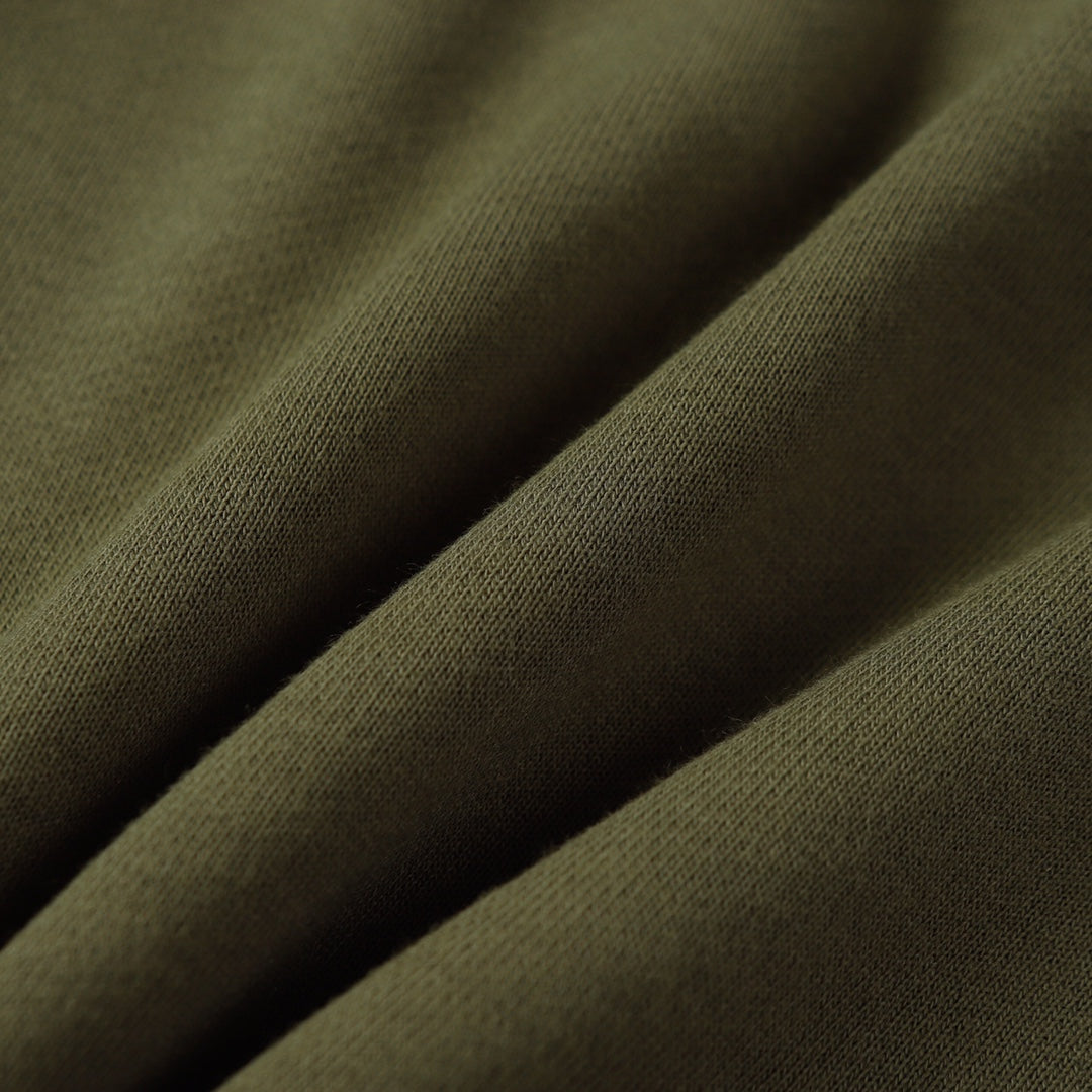 Olive fabric close-up with fine twill texture