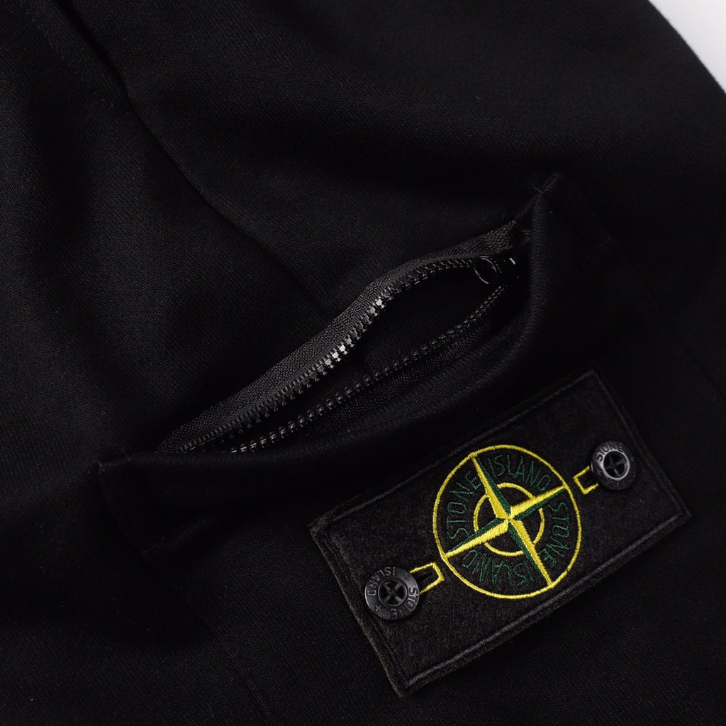 Black shorts with concealed zipper opening and logo patch on pocket