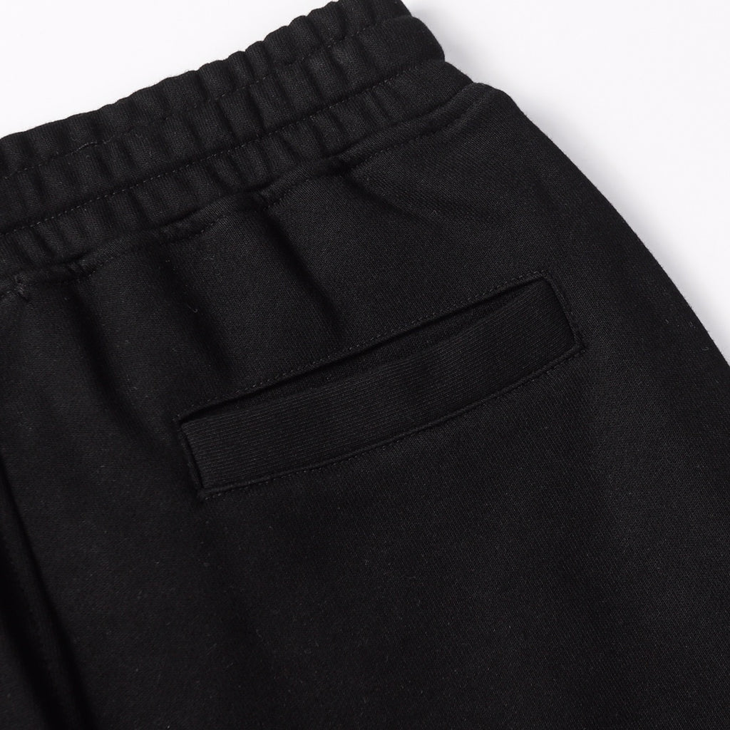 Black shorts with elastic waistband and front patch pocket