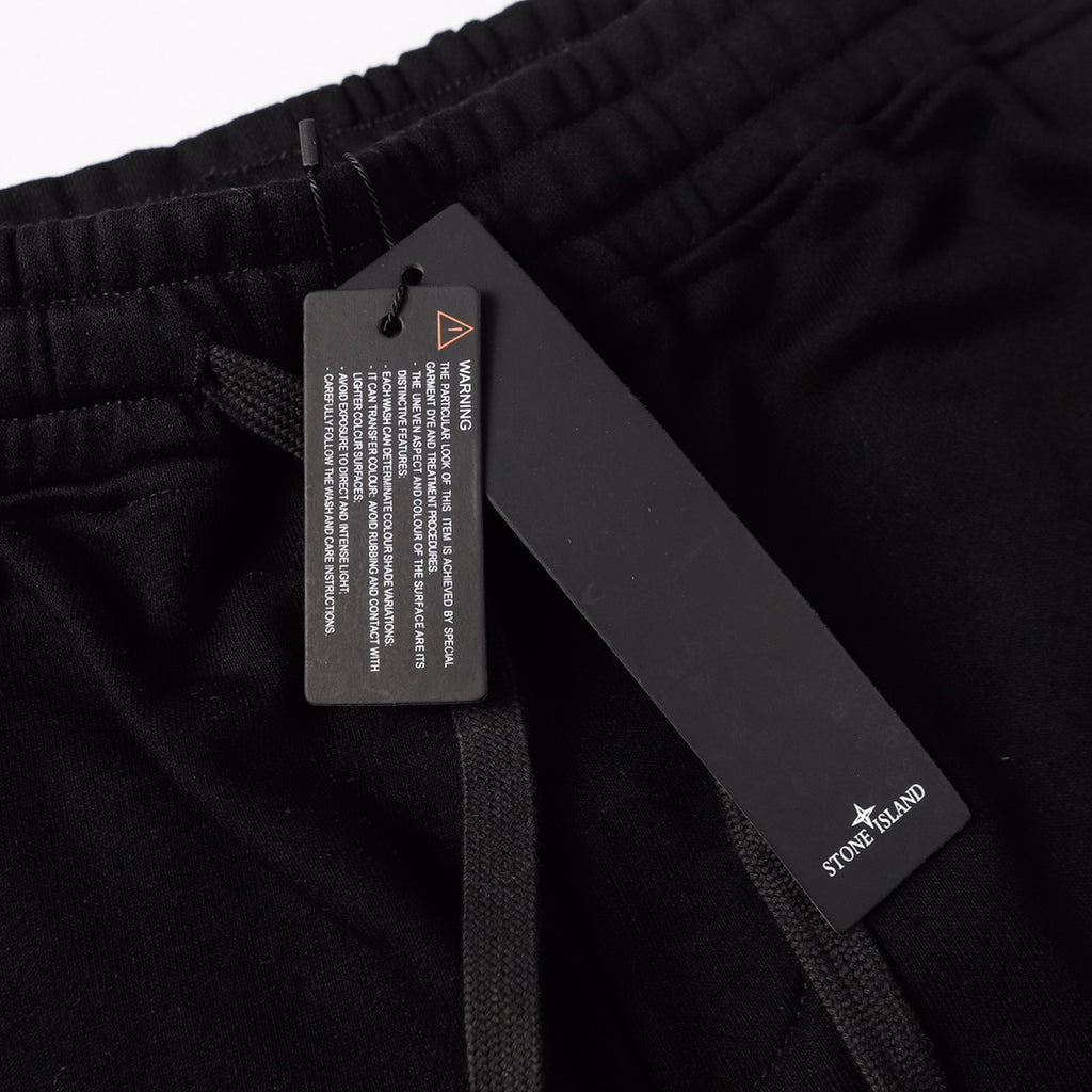Black shorts with internal drawstring and hanging tag at waistband