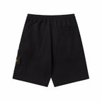 Black shorts with cargo-style side pockets and elastic waistband