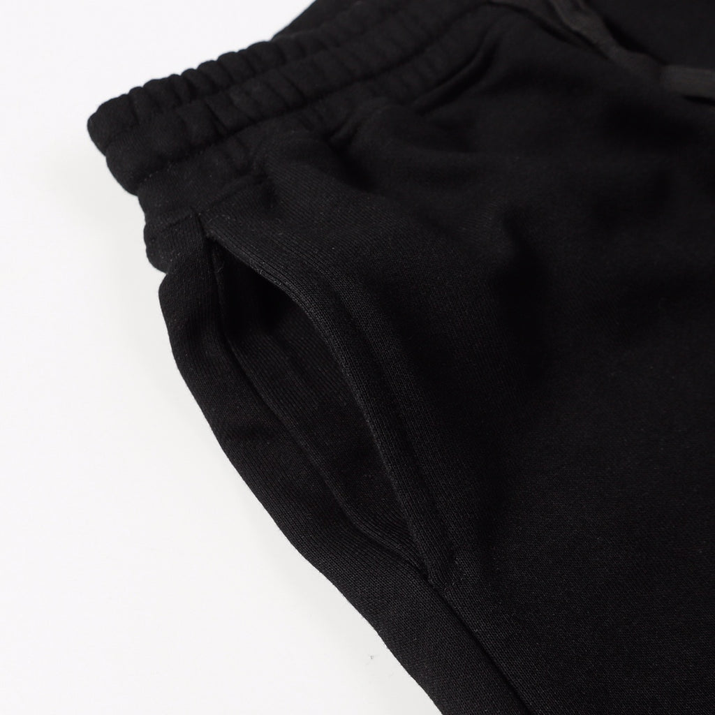 Black shorts fabric with elastic waistband and side seam detail
