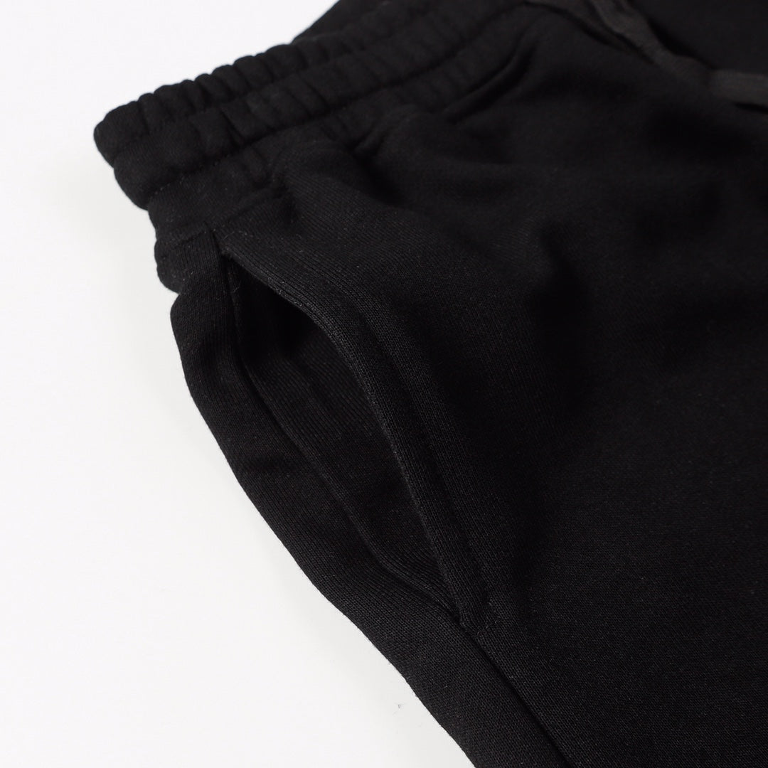 Black shorts fabric with elastic waistband and side seam detail