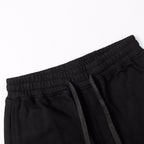 Black shorts with elastic waistband and black drawstring