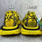 Balenciaga unisex yellow sneakers, heel-back view with BALENCIAGA logo on sole