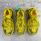 Balenciaga unisex yellow sneakers with black trim and lace-up front, side view