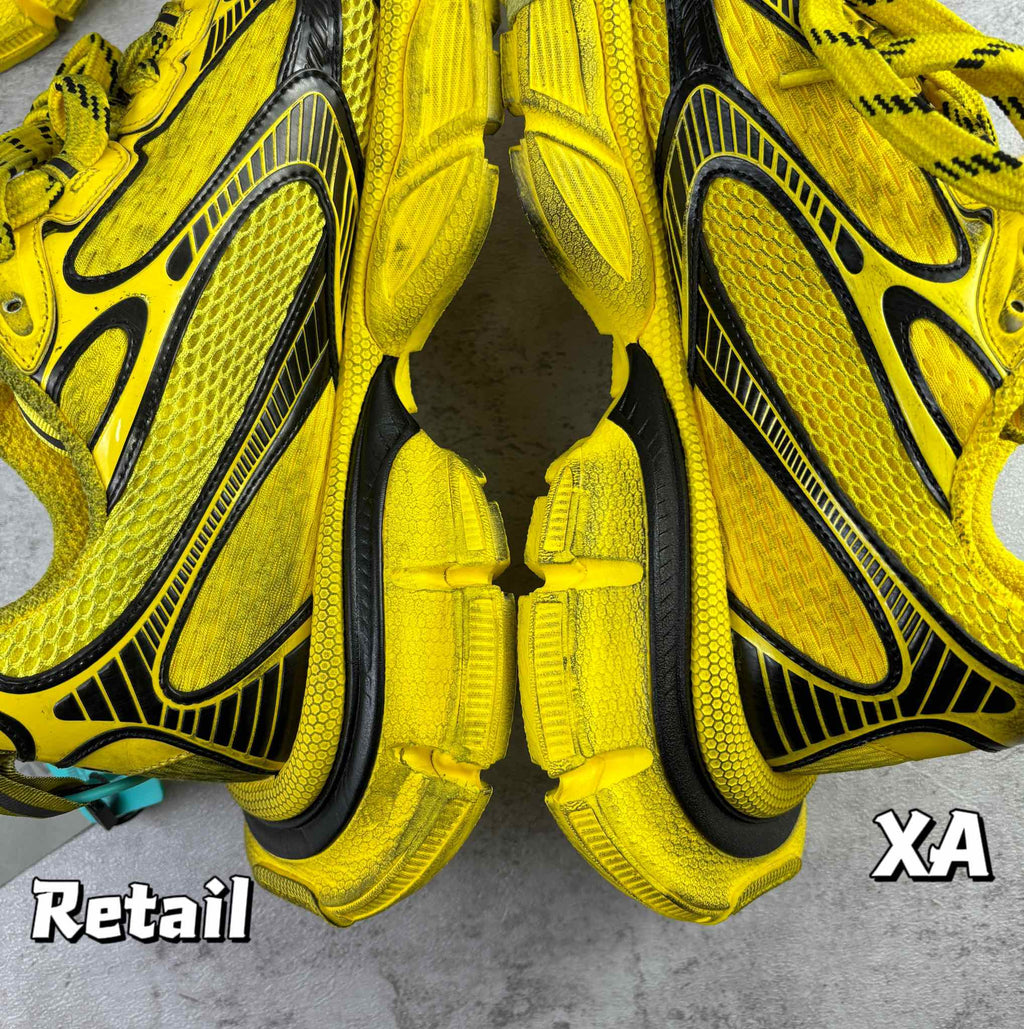 Balenciaga unisex yellow sneakers, close-up of tongue and lace-up front with black stripes