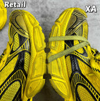 Balenciaga unisex yellow sneakers, close-up top view with laces and black side panels