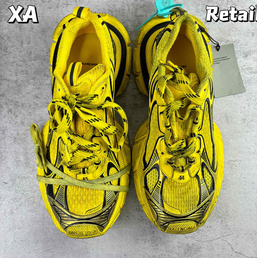 Balenciaga unisex yellow lace-up sneakers with black panels, front view