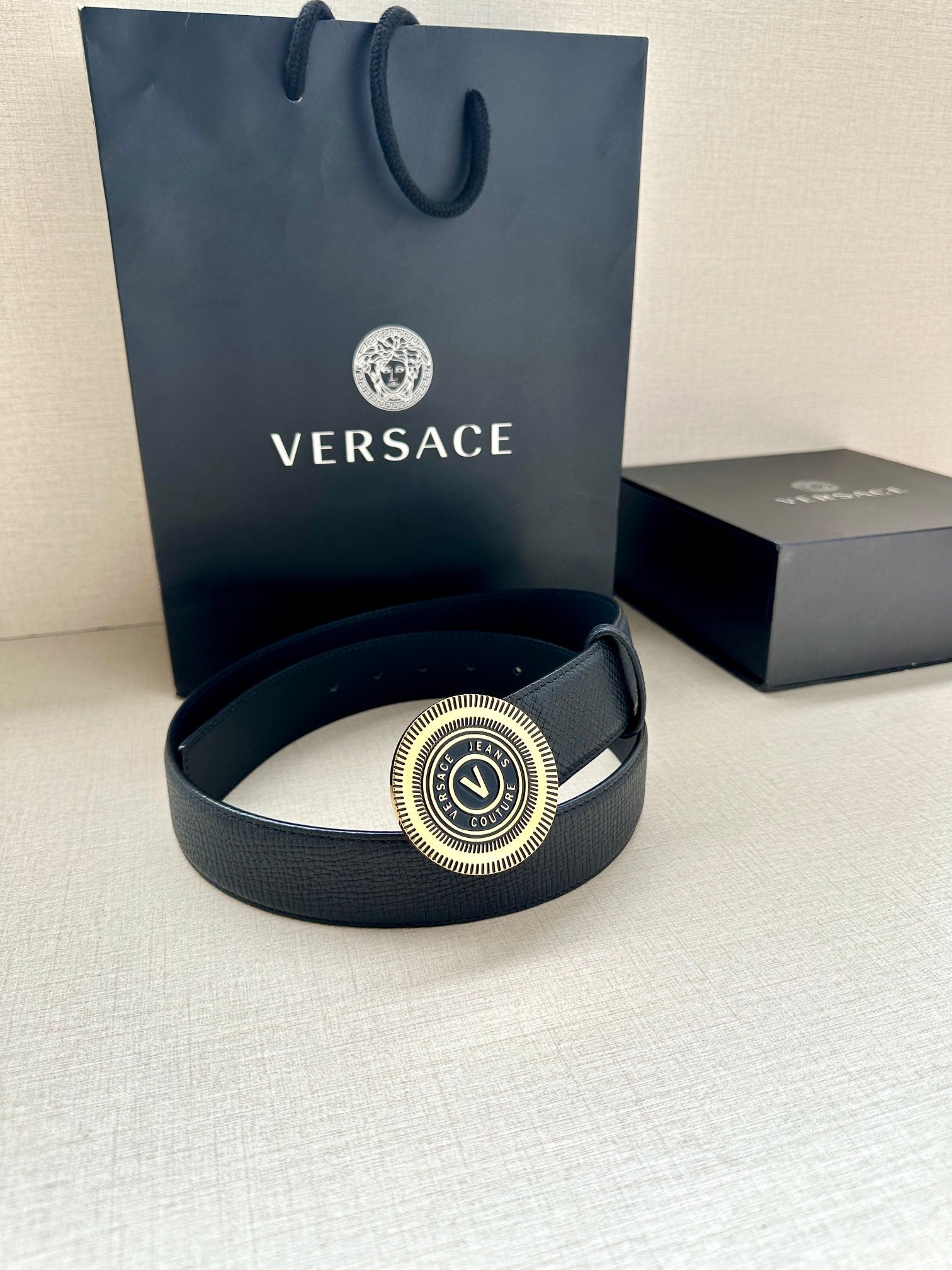 Versace belt in dark blue leather with round gold-tone logo buckle