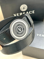 Versace Belt close-up: textured navy strap with round logo buckle