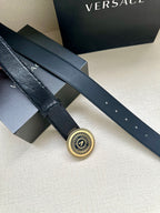 Versace Belt buckle close-up on dark navy strap with small eyelets