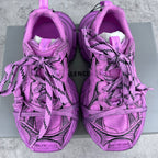 Pink Balenciaga lace-up sneakers front view with black details and cushioned tongue