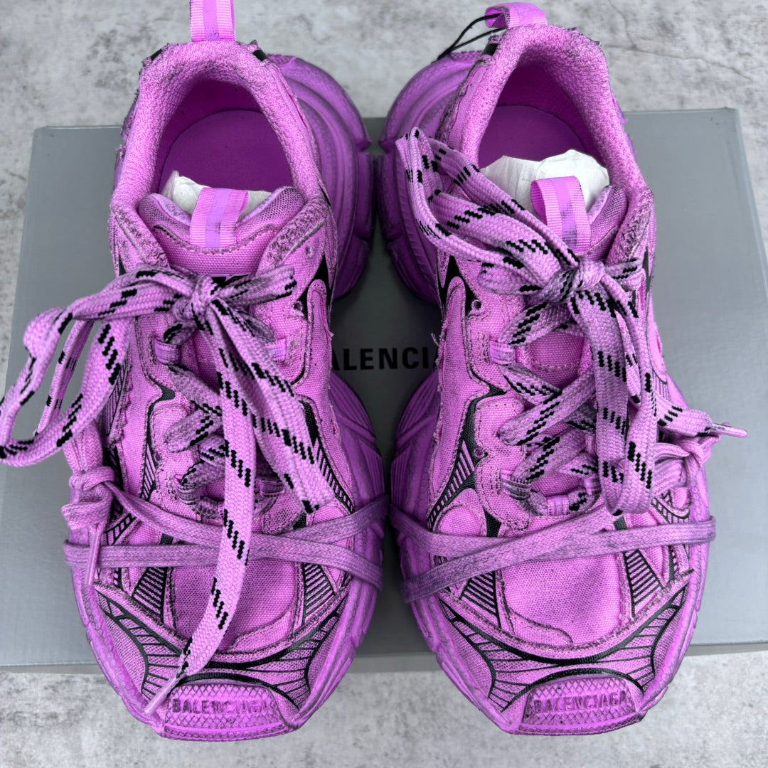 Pink Balenciaga lace-up sneakers front view with black details and cushioned tongue