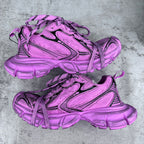 Pink Balenciaga lace-up sneakers pair with black accents and chunky rubber soles