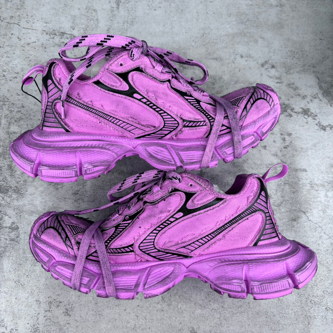 Pink Balenciaga lace-up sneakers pair with black accents and chunky rubber soles